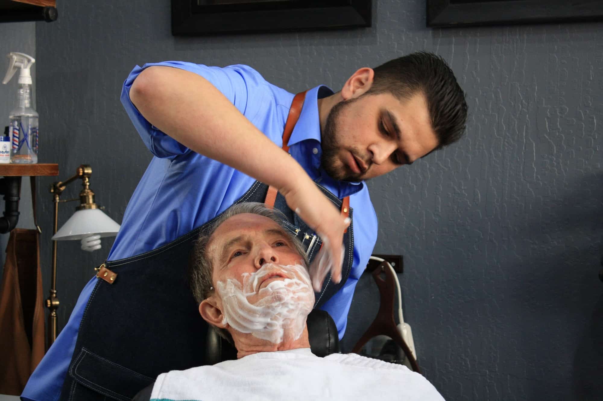 Nick Fontanez gives Mayor Bob Crowell a shave